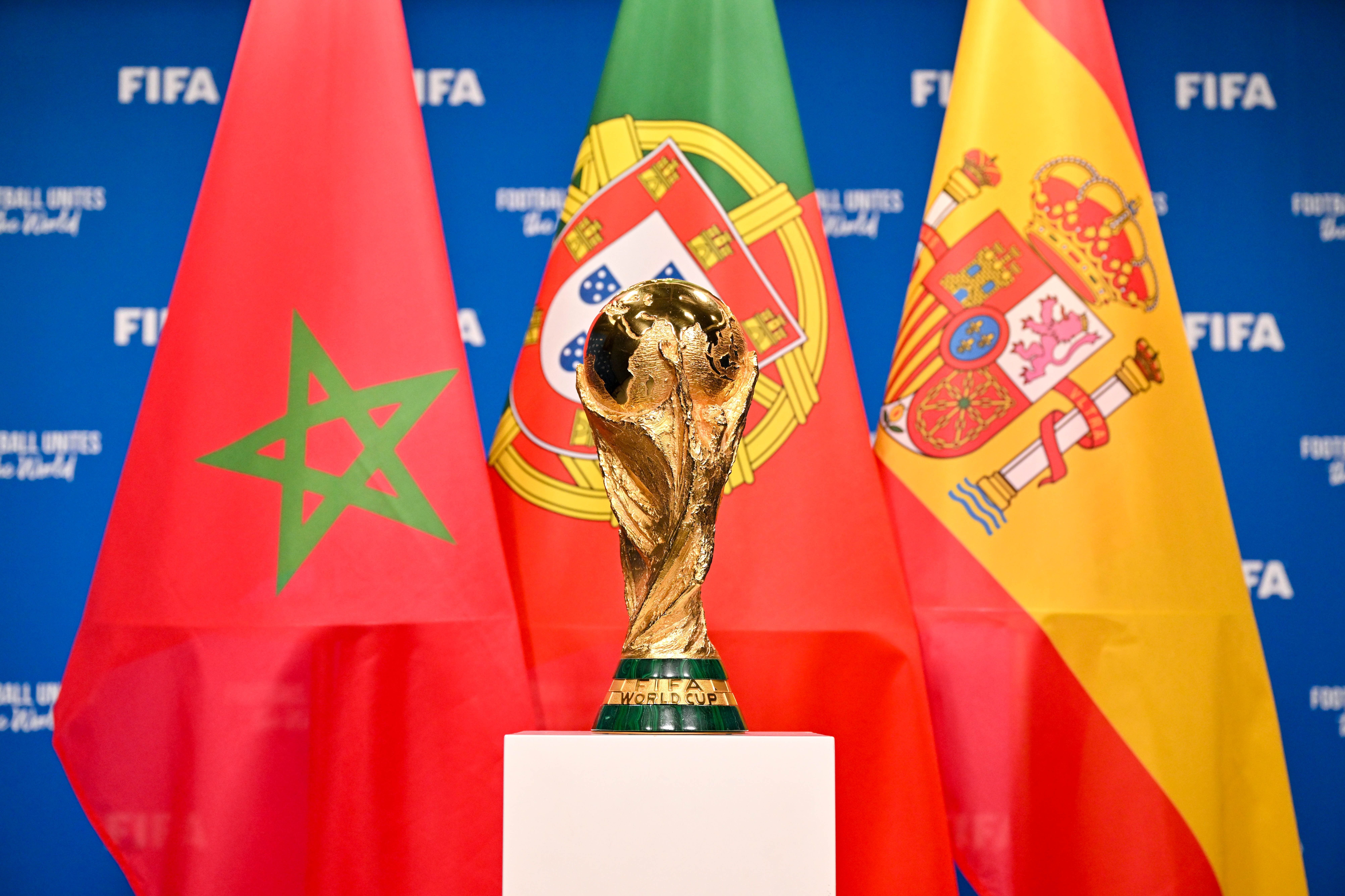 ZURICH, SWITZERLAND - DECEMBER 11: A view of the FIFA World Cup Winner's Trophy with the flags of the FIFA World Cup 2030 hosts Morocco, Portugal and Spain during a trophy shoot at the Home of FIFA on December 11, 2024 in Zurich, Switzerland. (Photo by Harold Cunningham - FIFA/FIFA via Getty Images)