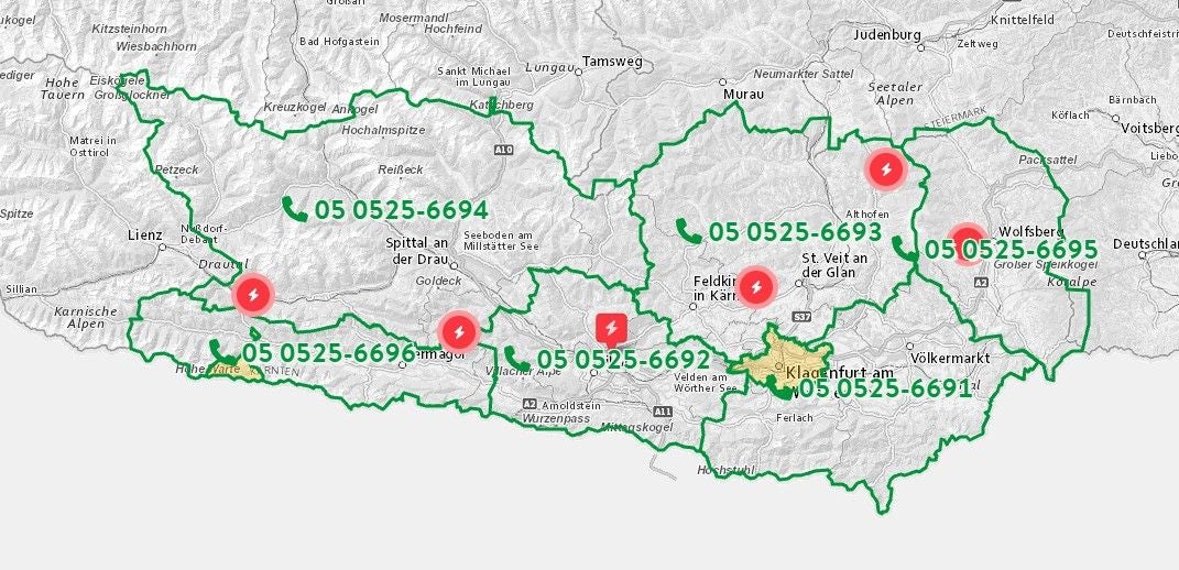 Karte von Kärnten mit markierten Stromausfällen und regionalen Servicenummern.