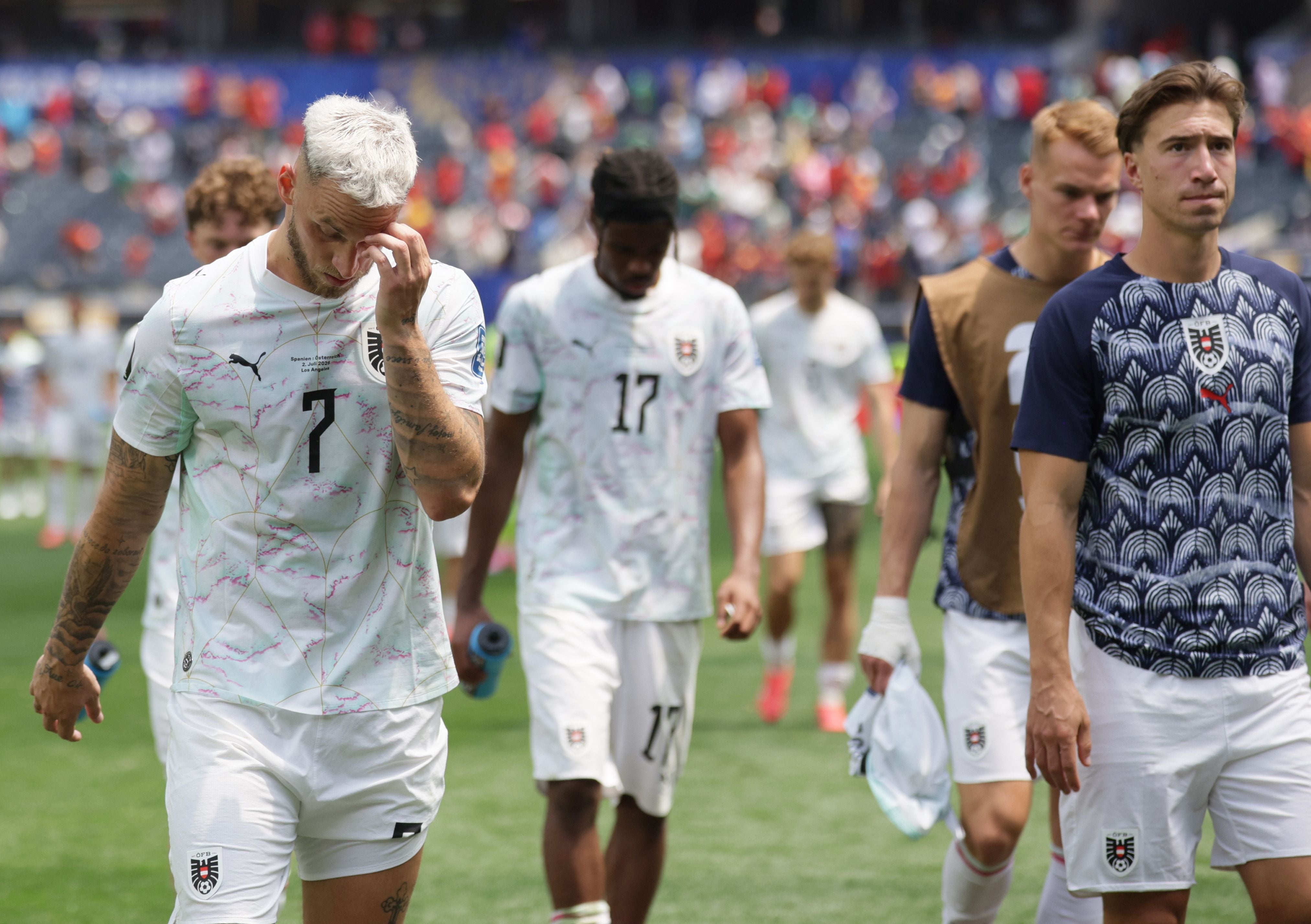epa13081676 Marko Arnautovic (L) of Austria leaves the pitch dejected after losing the FIFA World Cup 2026 Round of 32 match Spain against Austria, in Los Angeles, USA, 02 July 2026. EPA/CHRISTOPHER TORRES