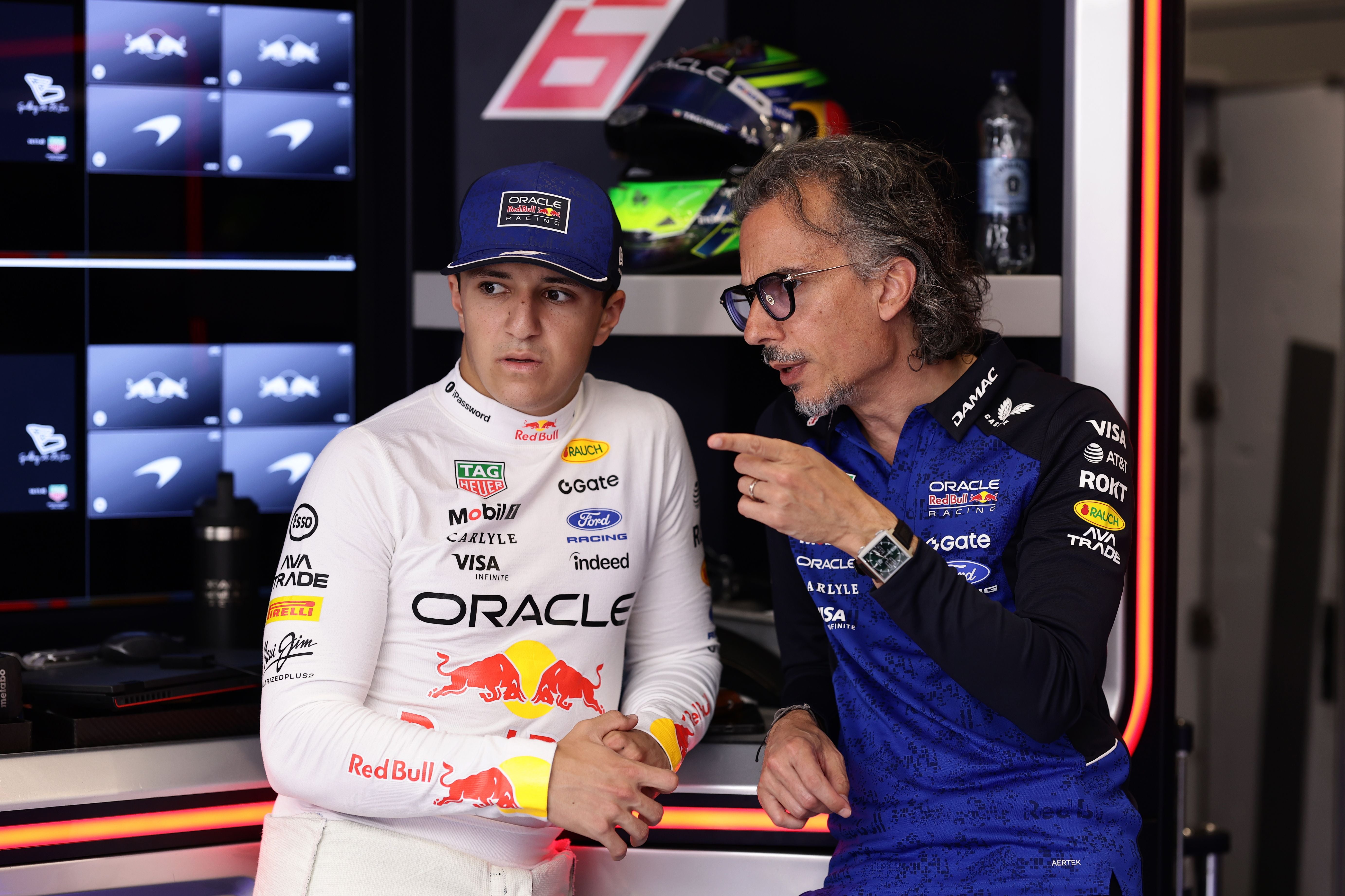 SPIELBERG, AUSTRIA - JUNE 28: Isack Hadjar of France and Oracle Red Bull Racing and Laurent Mekies, Team Principal of Oracle Red Bull Racing talk in the garage prior to the F1 Grand Prix of Austria at Red Bull Ring on June 28, 2026 in Spielberg, Austria. (Photo by Mark Thompson/Getty Images)