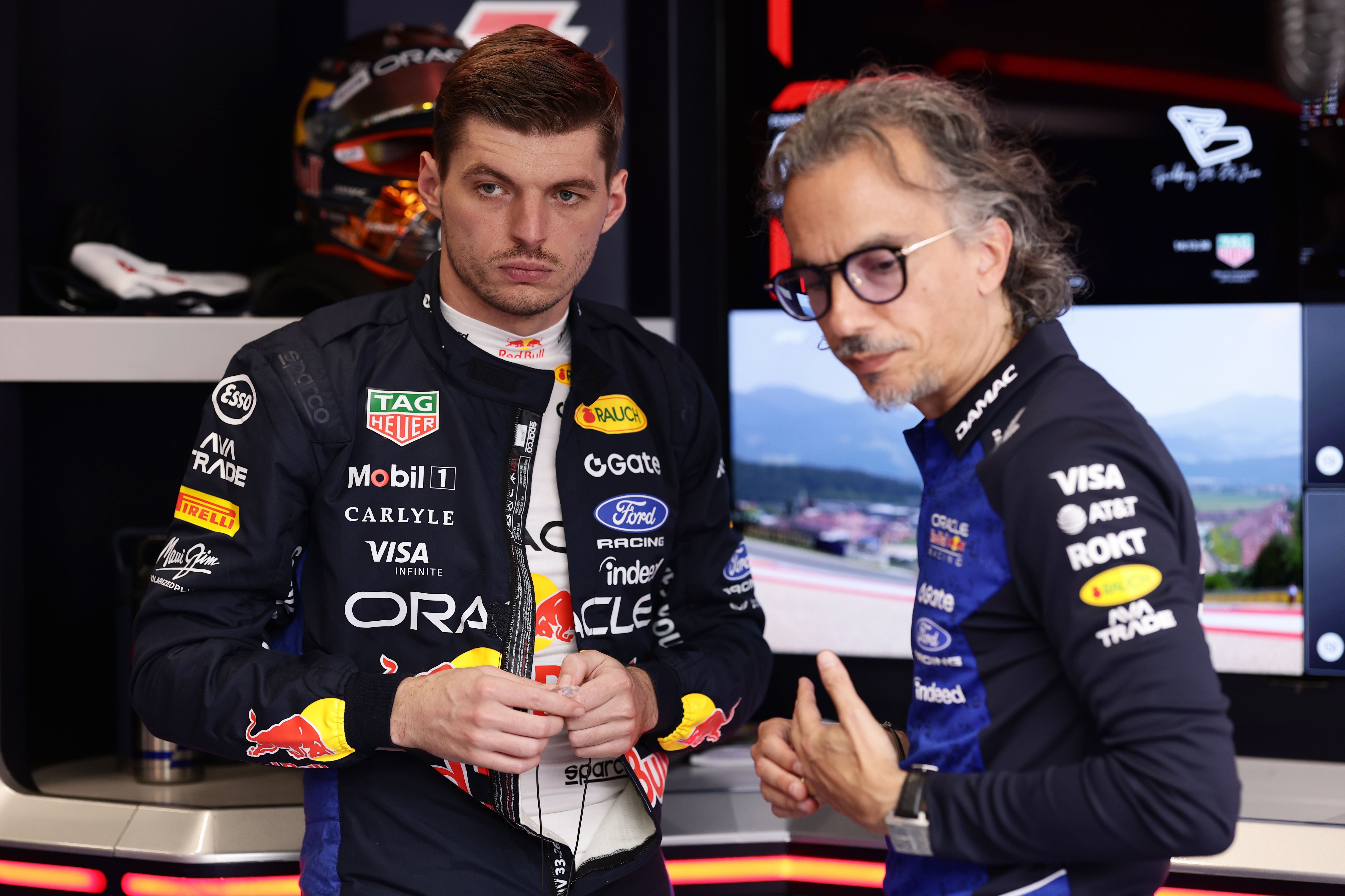 SPIELBERG, AUSTRIA - JUNE 28: Max Verstappen of the Netherlands and Oracle Red Bull Racing and Laurent Mekies, Team Principal of Oracle Red Bull Racing in the garage prior to the F1 Grand Prix of Austria at Red Bull Ring on June 28, 2026 in Spielberg, Austria. (Photo by Mark Thompson/Getty Images)