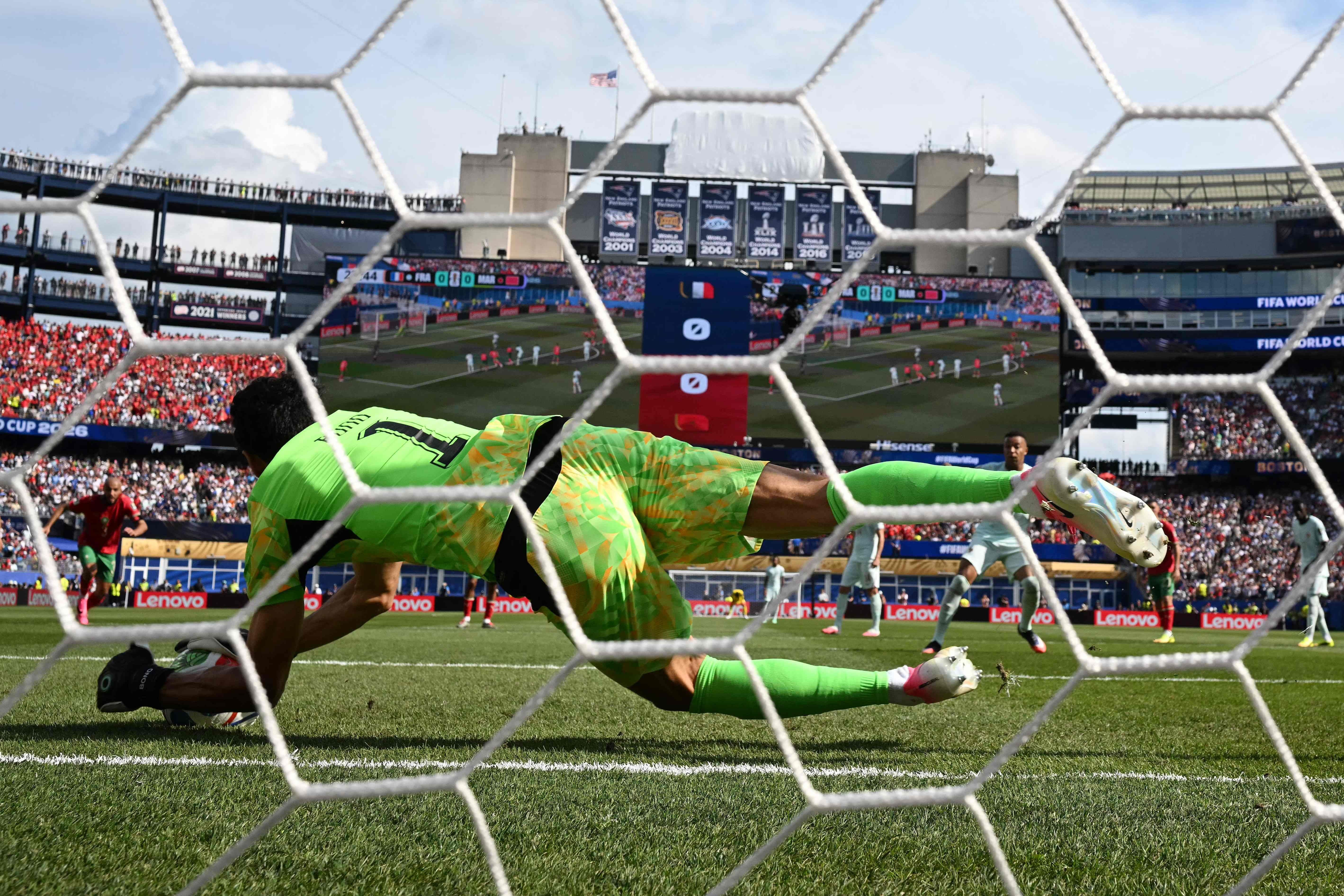Morocco's goalkeeper #01 Yassine Bounou saves a penalty kick by France's forward #10 Kylian Mbappe during the 2026 World Cup football tournament quarter-final match between France and Morocco at Boston Stadium in Foxborough on July 9, 2026. (Photo by MAURO PIMENTEL / AFP)