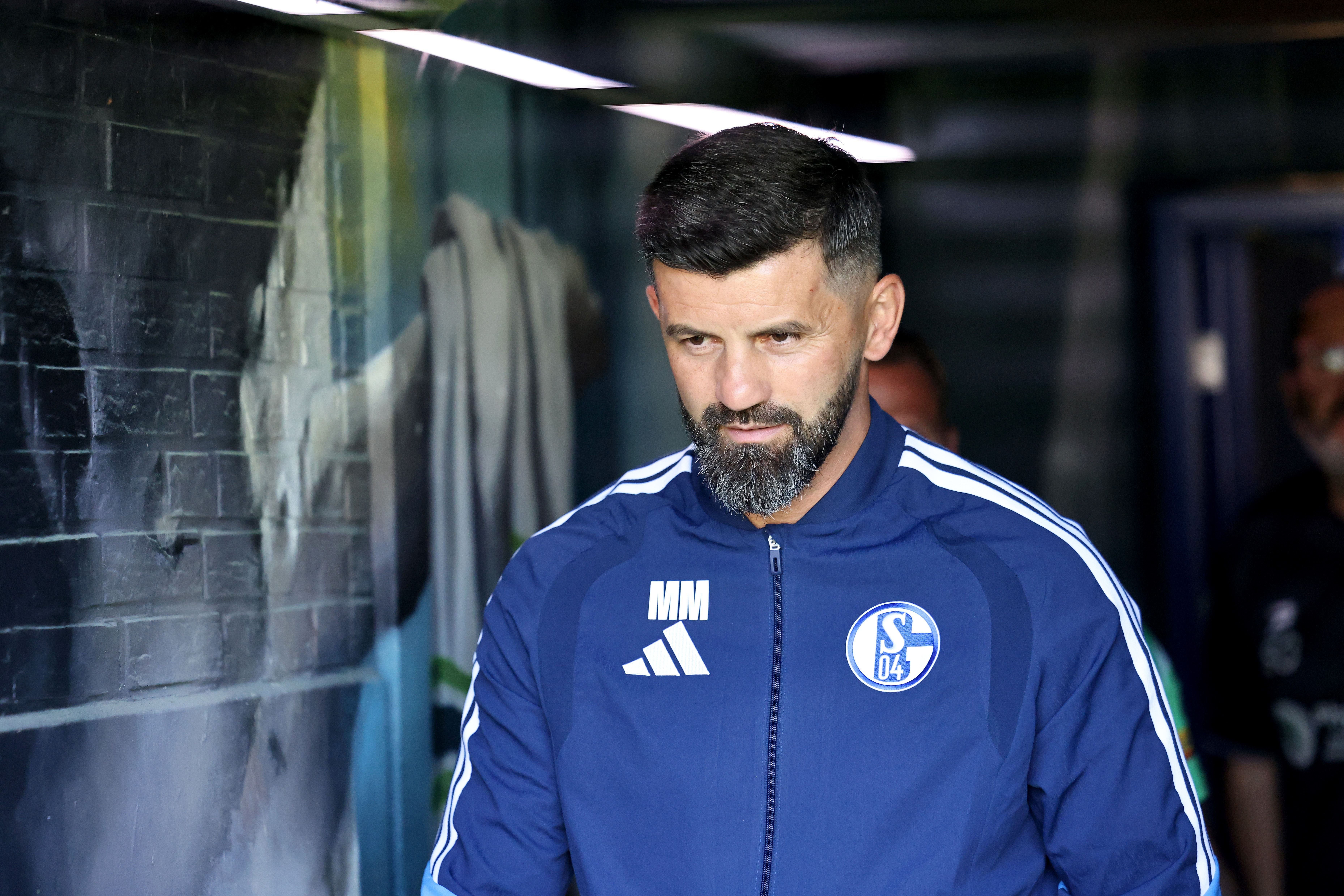 GUETERSLOH, GERMANY - JULY 11: Head coach Miron Muslic of FC Schalke 04 looks on prior to the pre-season friendly match between FC Gütersloh and FC Schalke 04 at Heidewaldstadion on July 11, 2026 in Guetersloh, Germany. (Photo by Christof Koepsel/Getty Images)