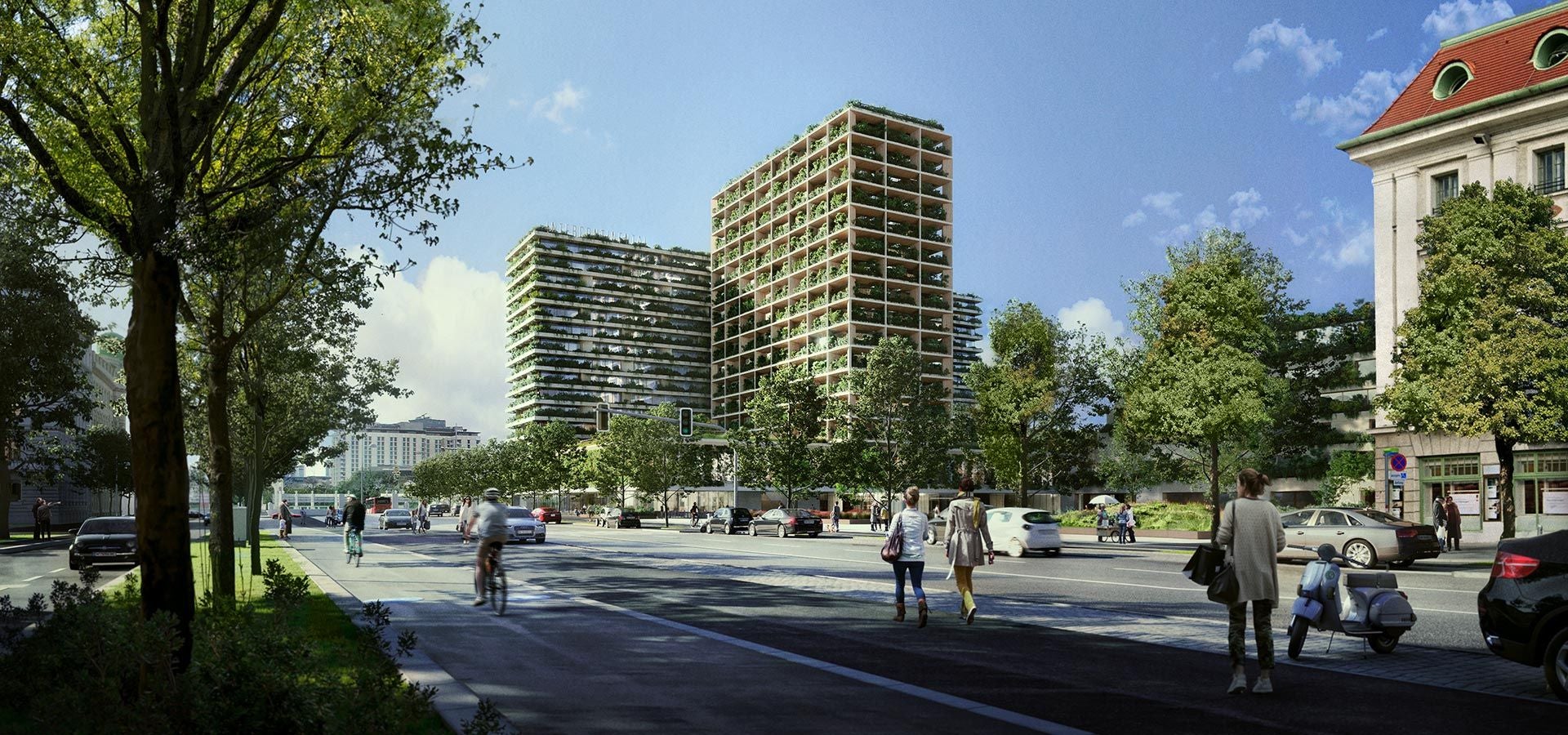 Straßenszene mit modernen Gebäuden, deren Fassaden mit vielen Pflanzen begrünt sind.