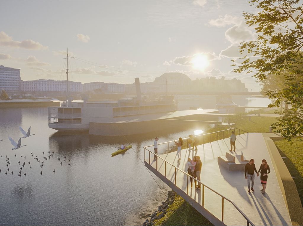 Menschen spazieren auf einer modernen Uferpromenade an der Donau bei Sonnenuntergang.