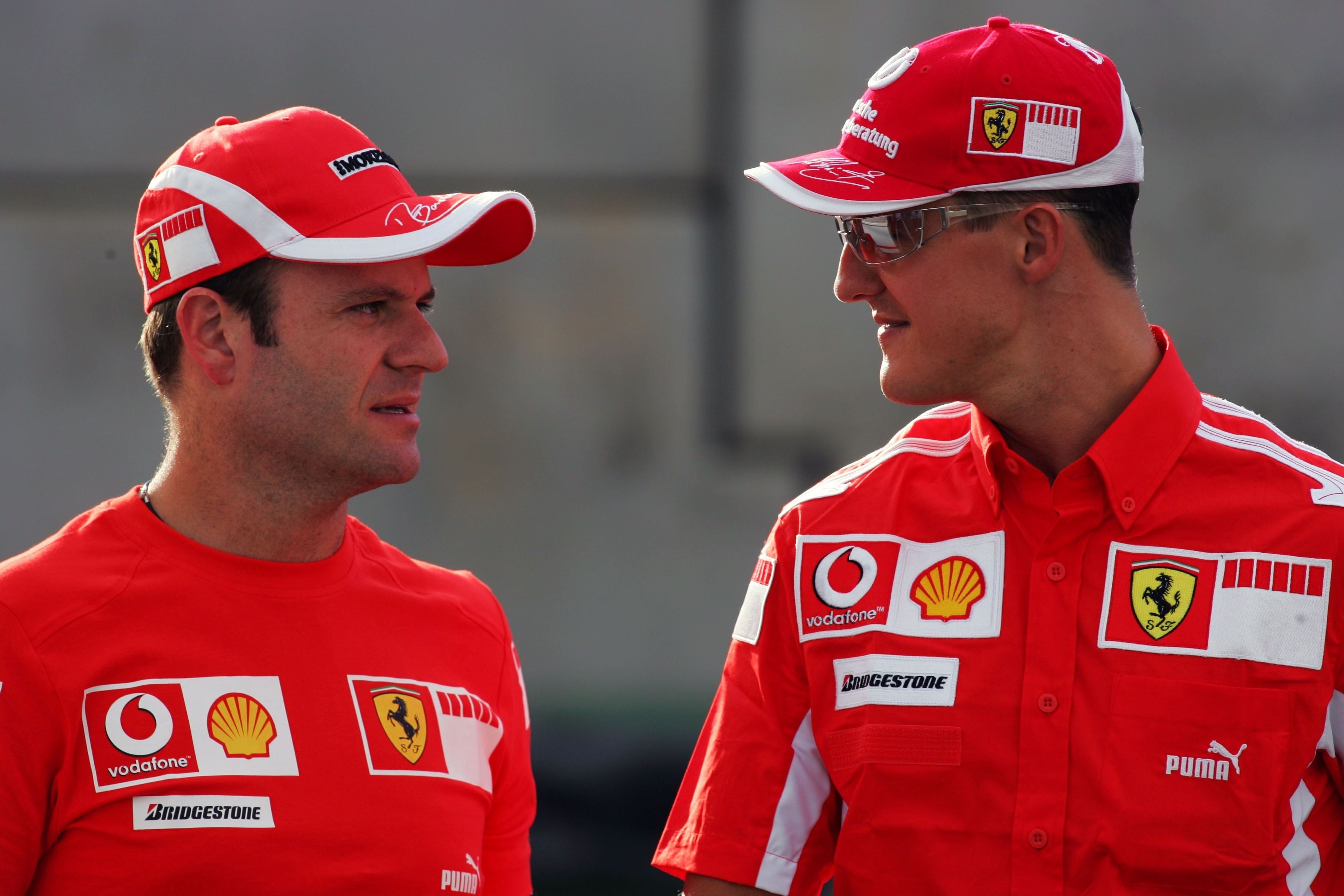 (L to R): Rubens Barrichello (BRA) Ferrari with team mate Michael Schumacher (GER) Ferrari. Formula One World Championship, Rd16, Belgian Grand Prix, Preparations, Spa Francorchamps, Belgium, 8 September 2005. DIGITAL IMAGE (Photo by Gareth Bumstead/Sutton Images)