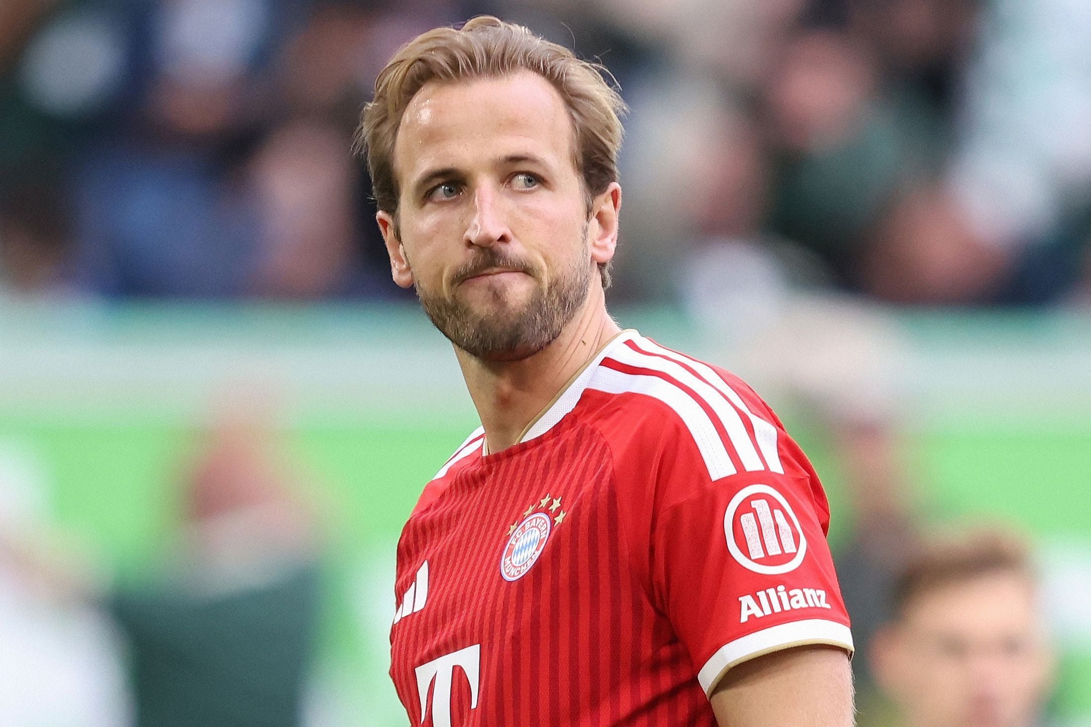 (FILES) Bayern Munich's English forward #09 Harry Kane reacts after missing a penalty during the German first division Bundesliga football match between VfL Wolfsburg and FC Bayern Munich in Wolfsburg, on May 9, 2026. Bayern Munich striker Harry Kane has said he is set to start negotiations to extend his contract with the Bundesliga champions beyond 2027. Speaking at a media day in Munich on August 18, 2026, the 33-year-old England captain told reporters the discussions had been delayed until after he returned from a post-World Cup holiday, but would begin soon. (Photo by Ronny HARTMANN / AFP) / DFL REGULATIONS PROHIBIT ANY USE OF PHOTOGRAPHS AS IMAGE SEQUENCES AND/OR QUASI-VIDEO ALTERNATIVE CROP