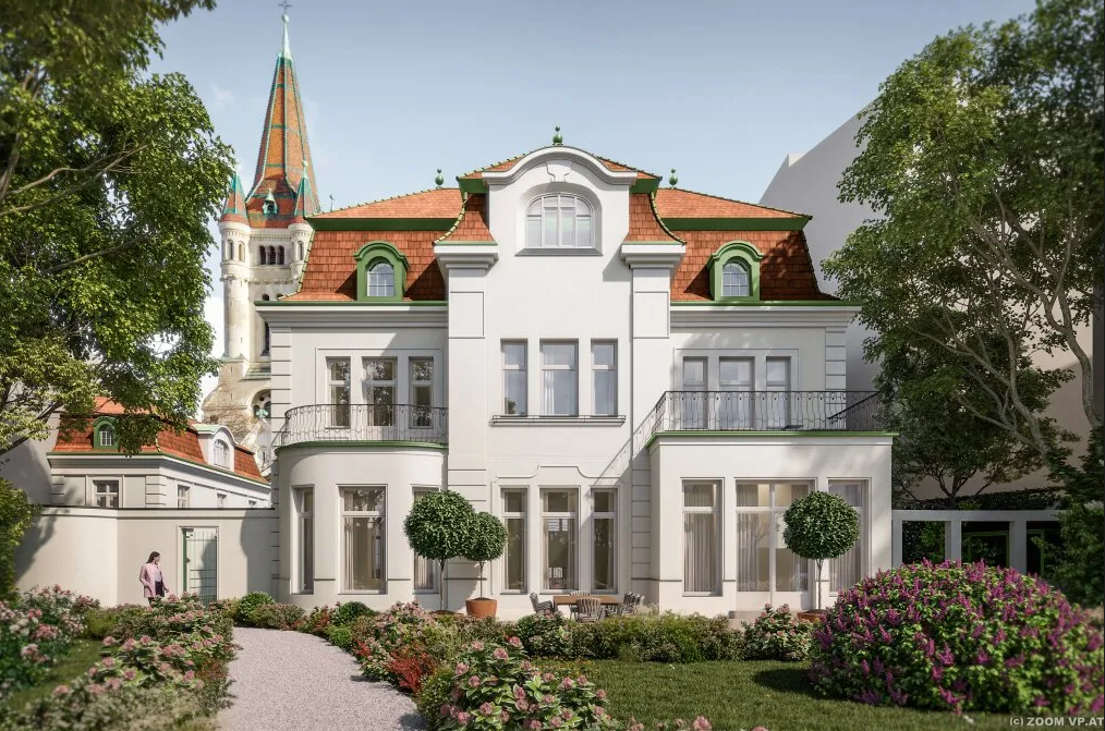 Prächtige weiße Villa mit Garten und Türmen im Hintergrund bei Sonnenschein.