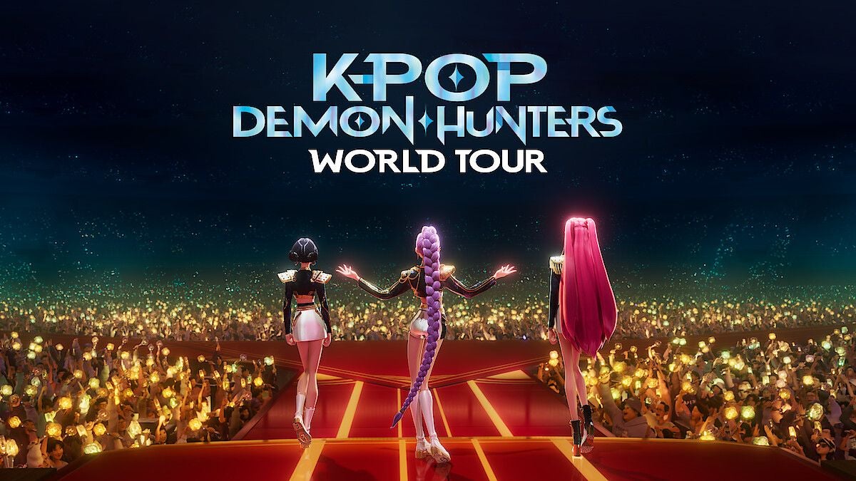 Drei animierte K-Pop-Sängerinnen stehen auf einer Bühne vor jubelndem Publikum.