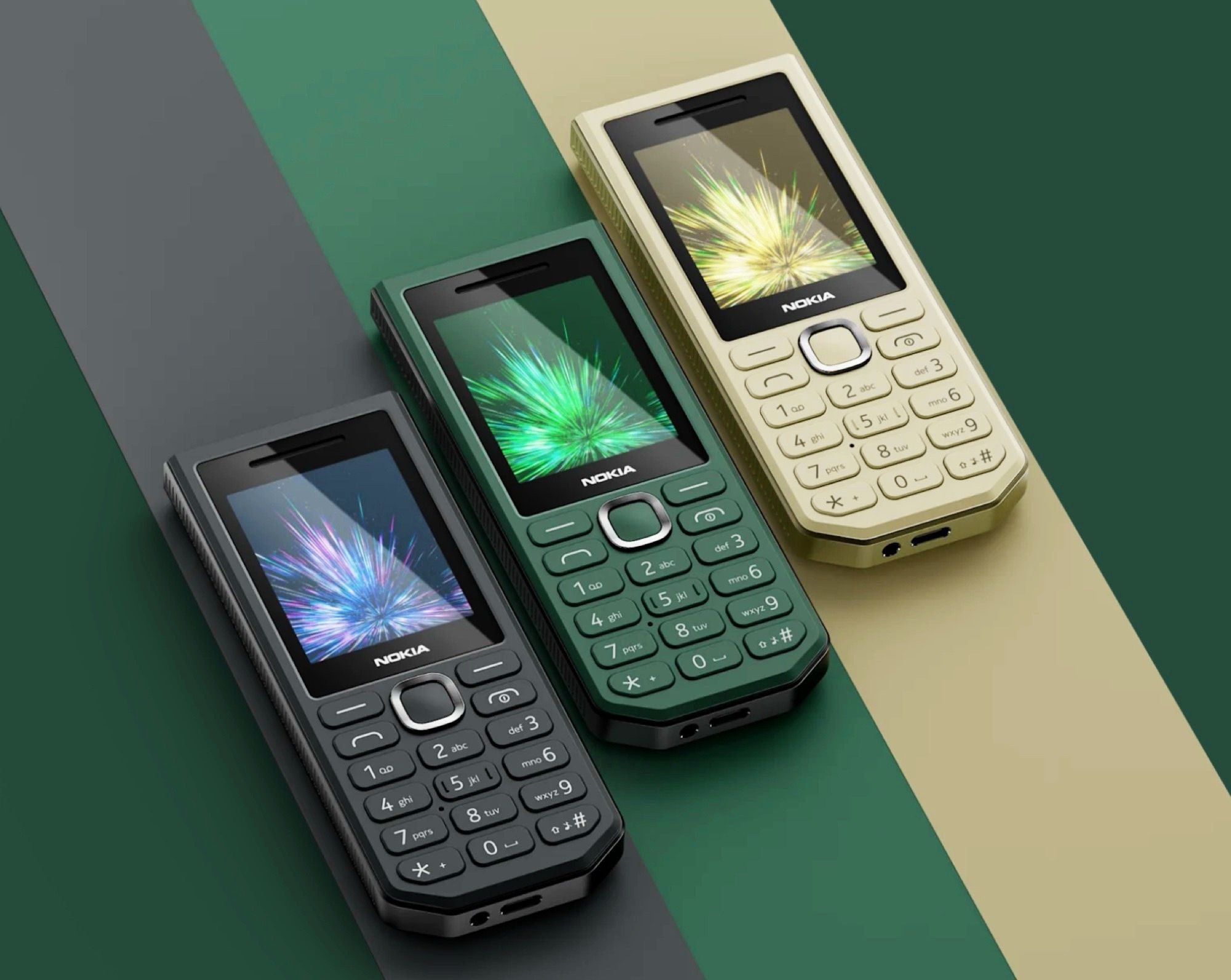 Drei Nokia 300 Charge Handys in Schwarz, Grün und Beige auf farbigen Streifen.