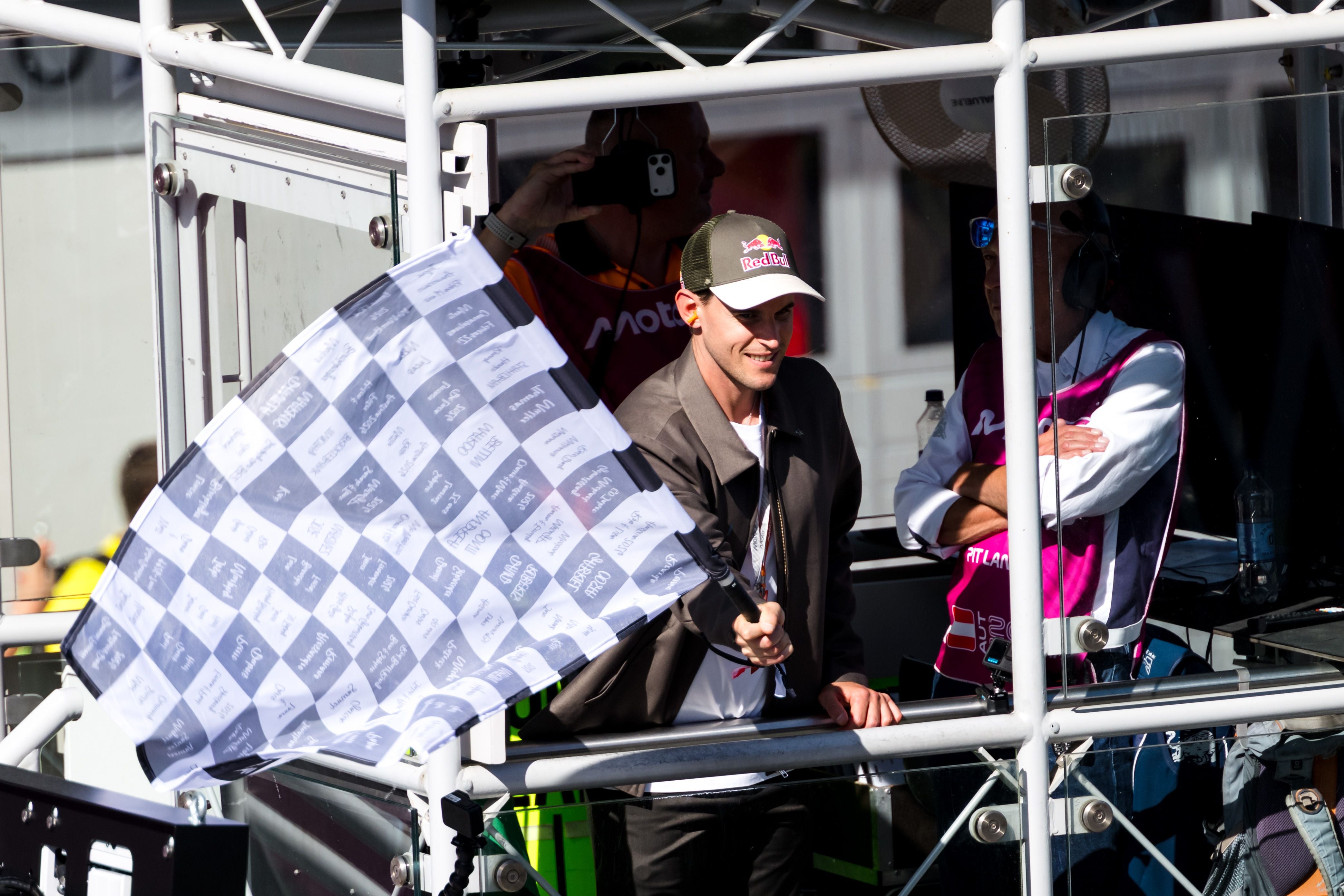 SPIELBERG,AUSTRIA,20.SEP.26 - MOTORSPORTS - MotoGP, Grand Prix of Austria, Red Bull Ring. Image shows Dominic Thiem with star finish flag. Photo: GEPA pictures/ Matic Klansek
