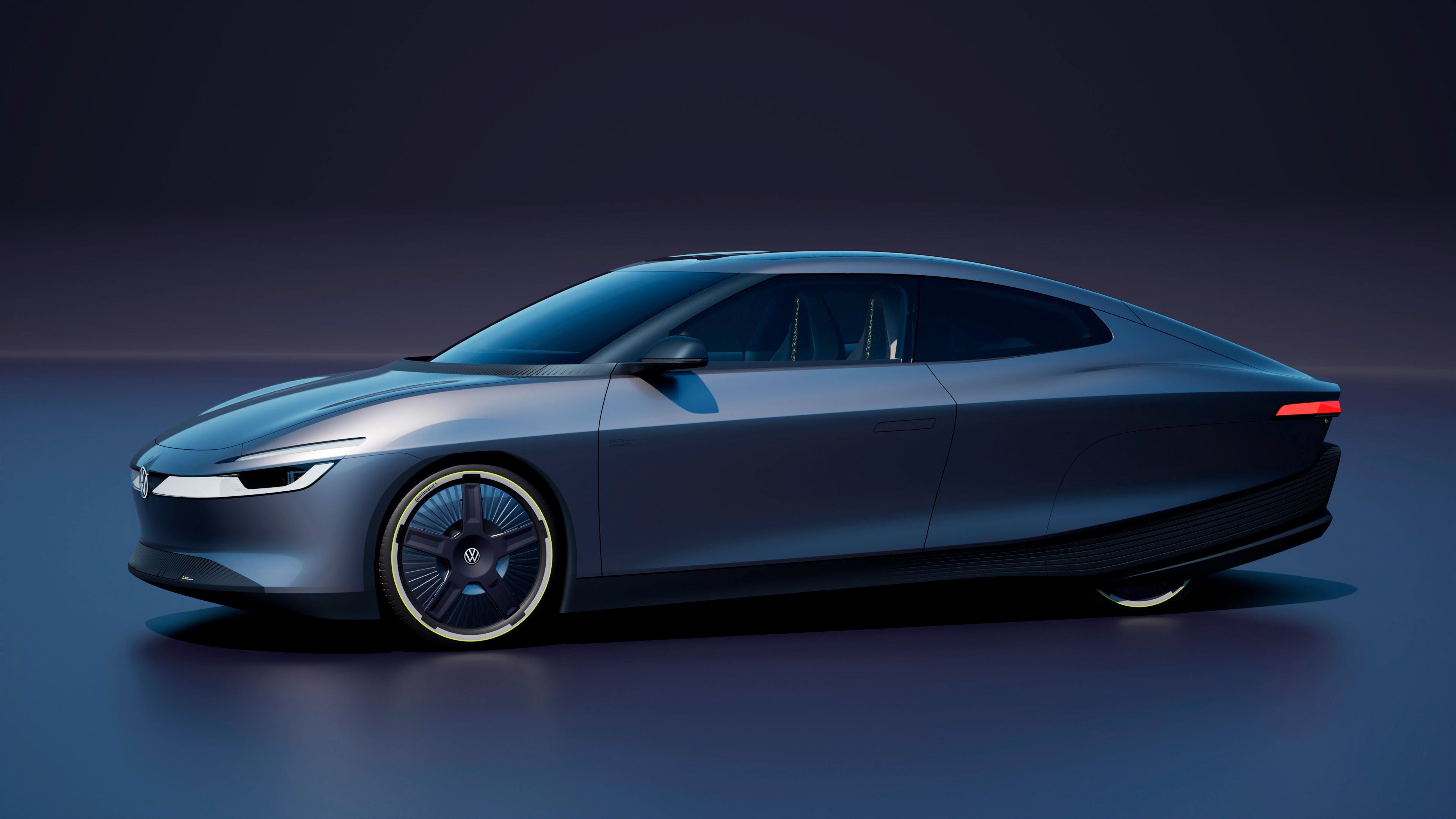 Dunkelblauer, futuristischer Volkswagen mit aerodynamischem Design und leuchtenden Felgen.