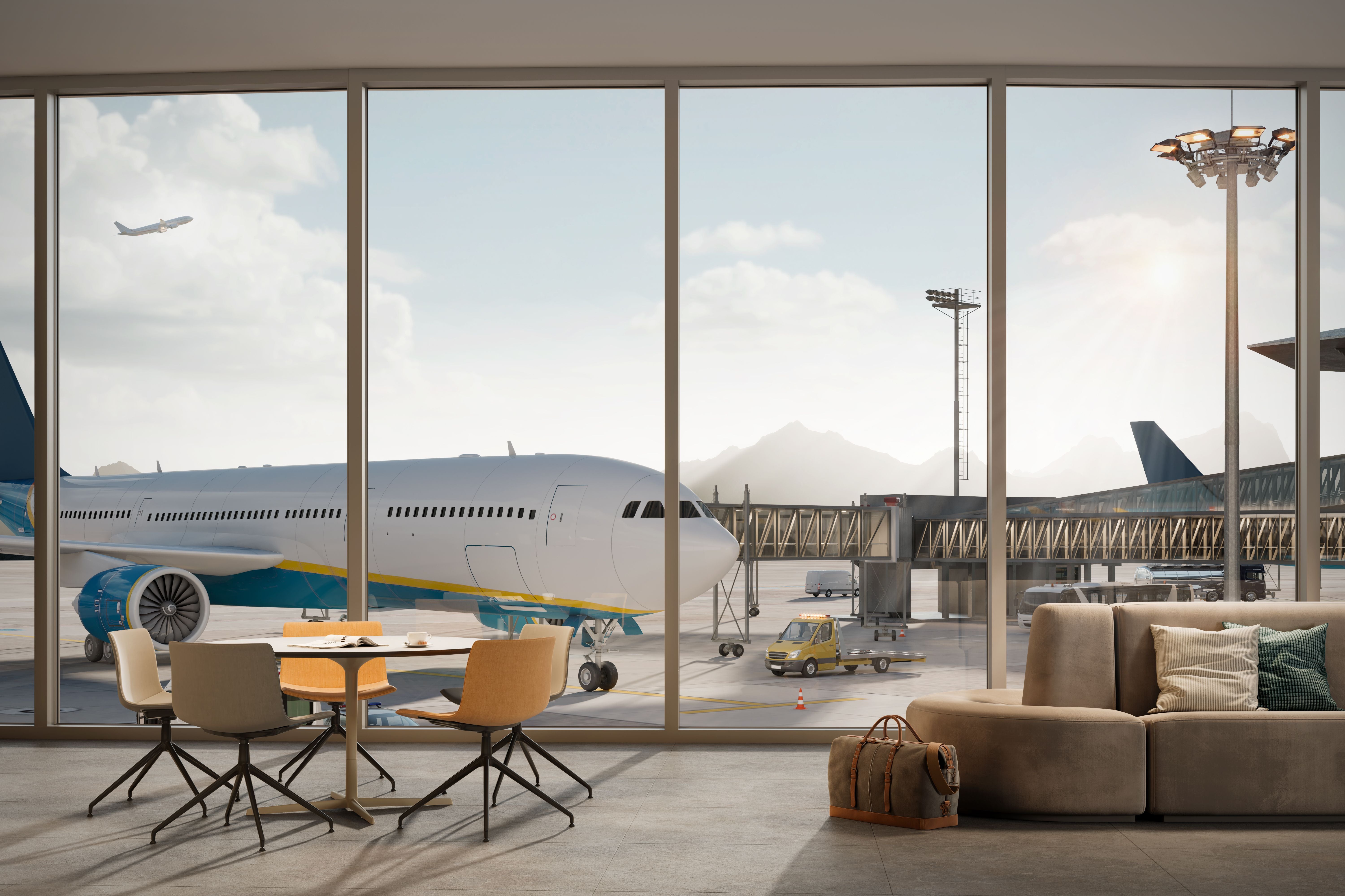 Flugzeug am Terminal, gesehen aus einer modernen Flughafenlounge mit Sitzgruppe und Gepäck.
