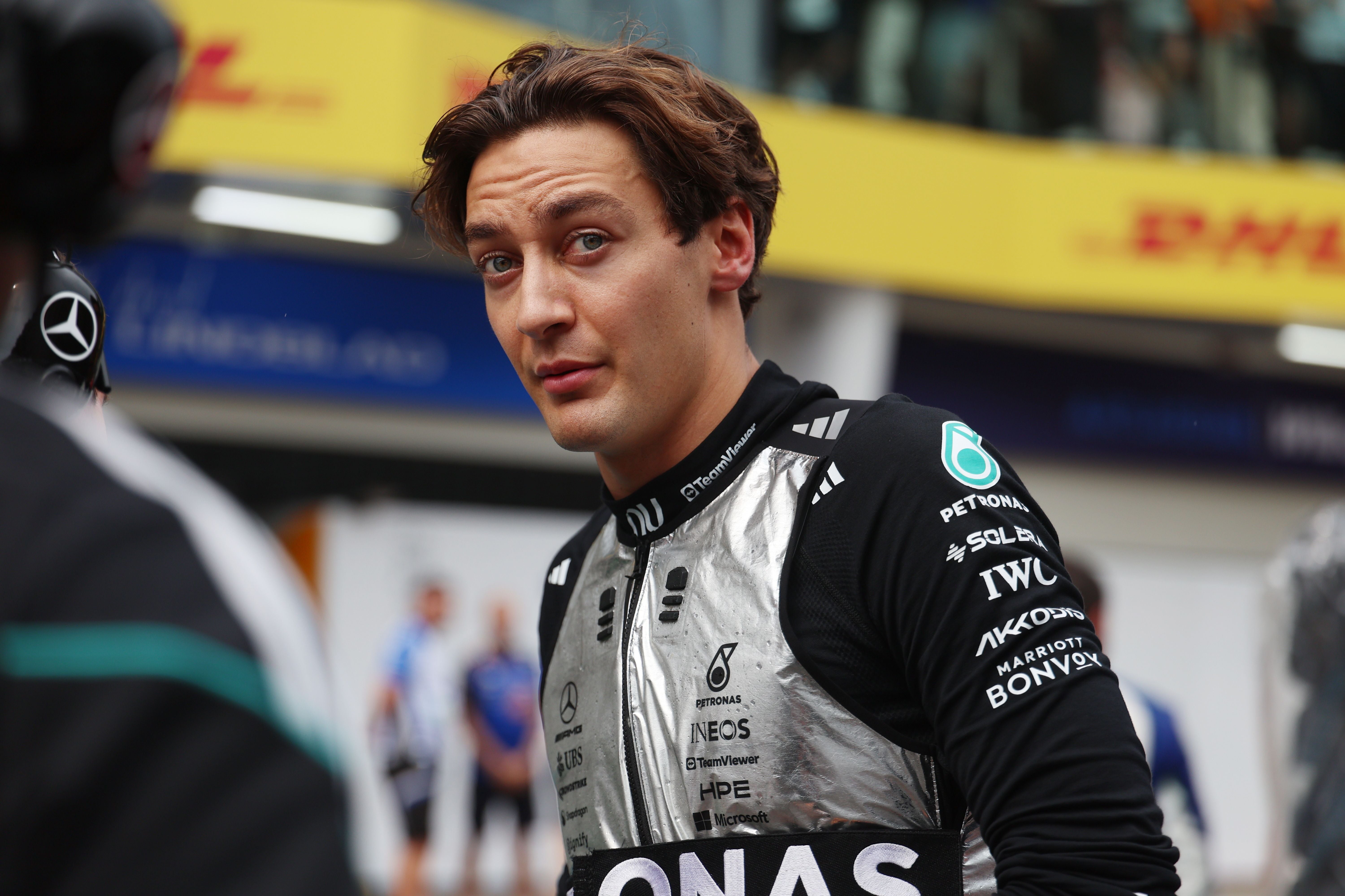 epa13280214 Mercedes driver George Russell of Britain walks in the pit lane as the start of the race is delayed in the 2026 Formula 1 Bahrain Grand Prix at the Sepang International Circuit in Malaysia, in Sepang, Malaysia, 04 October 2026. EPA/ANNICE LYN / POOL