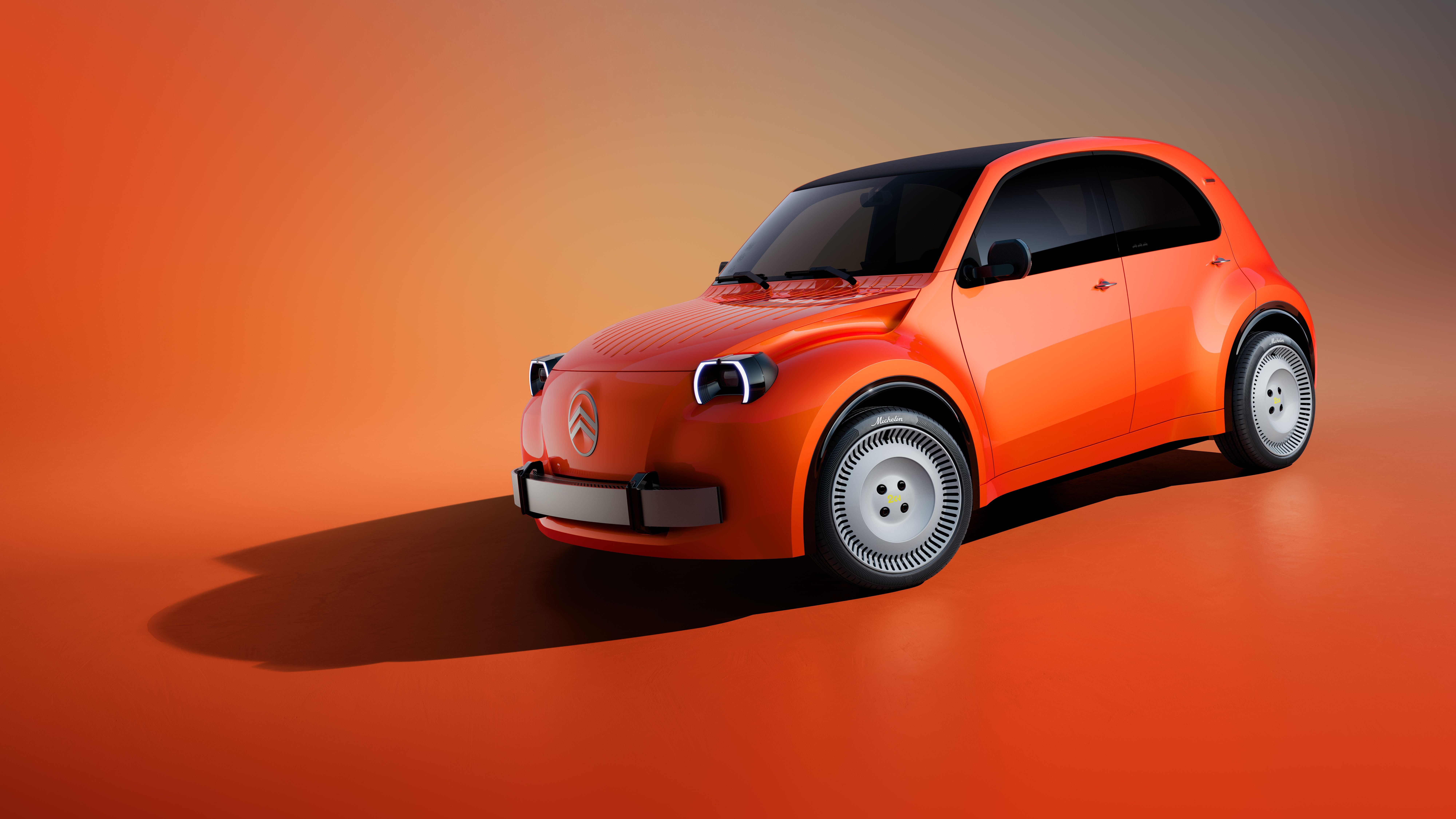 Orangefarbener Citroën 2CV Concept mit abgerundeten Formen auf orangem Hintergrund.