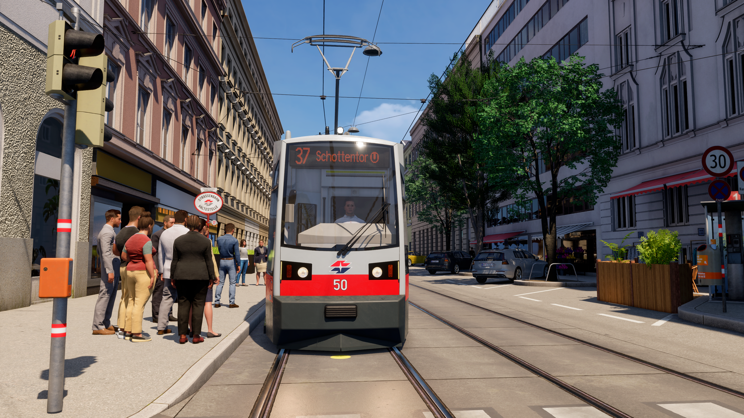 Straßenbahn der Linie 37 hält an einer Haltestelle in einer Stadt, mehrere Menschen warten ein.