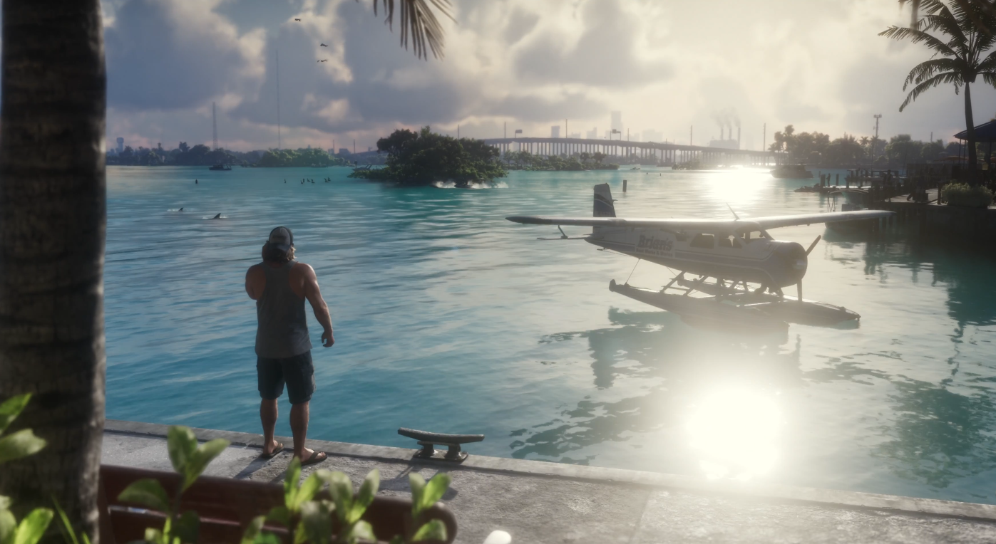 Ein Mann steht am Wasser, vor ihm ein Wasserflugzeug bei Sonnenuntergang, tropische Kulisse.